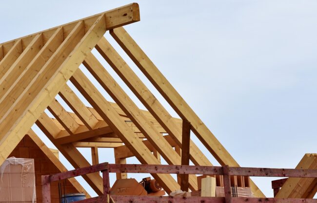 Housing being built showing the timbers of the roof
